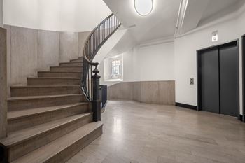 Staircase with railing at Grand Central Market Apartments, Los Angeles, 90013